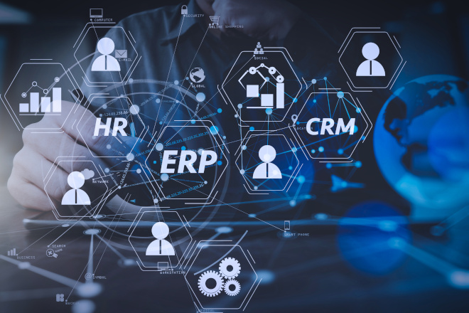 An abstract image of enterprise resource planning (ERP) software with HR and CRM modules over a tablet. Courtesy Adobe.